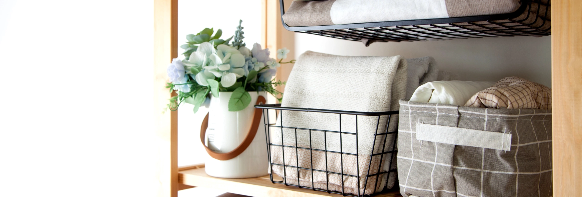 Clean Linens In Storage Baskets On A Shelf 1920X650